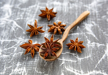 Star anise in a wooden spoon