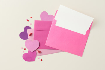 Valentines card on a pastel background viewed from above. Love symbols. Top vew. Copy space