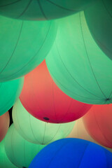 Balloons with colorful light effects creating a rainbow spectrum