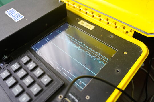 Almaty, Kazakhstan - 12.20.2023 : A portable suitcase is a seismograph. A monitor with indicators of the strength of tremors.