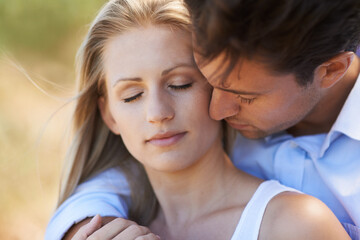 Couple, hug and embrace in nature for love, bonding or support for outdoor affection or comfort....