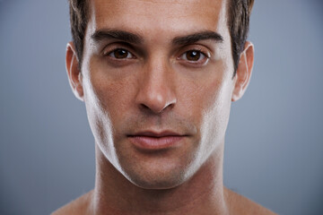 Portrait, skincare and man with dermatology, wellness and confident guy on grey studio background....