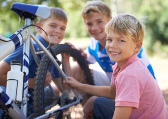 Children, bicycle and portrait for fixing in park, repairs and excited for fun outdoor on vacation....