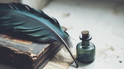Feather quill and inkwell resting on an antique book