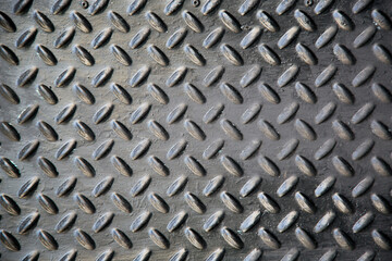 Weathered iron wall with seamless background of iron products