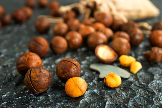 Organic Macadamia nut on wooden table, helthy food