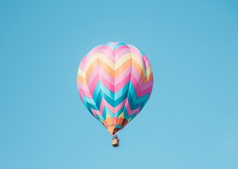 Fototapeta premium Colorful Hot Air Balloon Soaring in Blue Sky