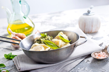 dumplings with sauce, boiled dumplings in metal bowl - 720308546