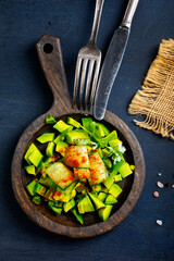 Diet avocado salad with cucumber and green onions - 720308770