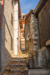 Old houses in the historic hill village of Timau in Udine Province, Friuli-Venezia Giulia, NE...