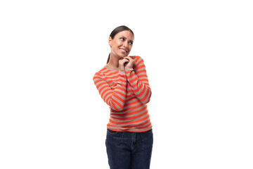 young european woman with black hair looks dreamily to the side