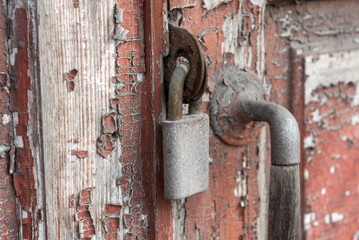 old vintage lock on a wooden door