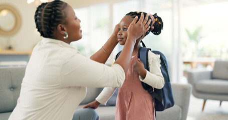 Getting ready, morning and a mother with a child for school, leaving kiss and talking in the living room. Happy, speaking and an African mom helping a girl with a backpack in a house for kindergarten - obrazy, fototapety, plakaty