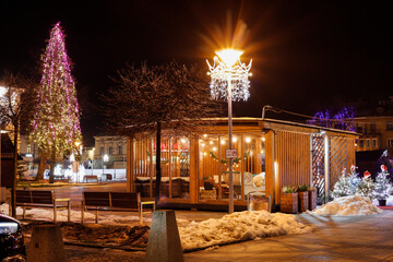 NOWY TARG, POLAND - DECEMBER 19, 2023: Beautiful, shiny Christmas light decorations in Nowy Targ,...