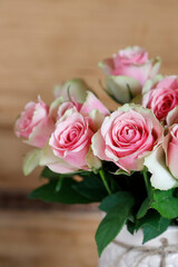 Bouquet of pink roses in a vase.