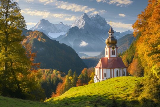 Iconic picture of Bavaria with Maria Gern church with Hochkalter peak on background. Fantastic autumn sunrise in Alps. Superb evening landscape of Germany countryside. Traveling concept background