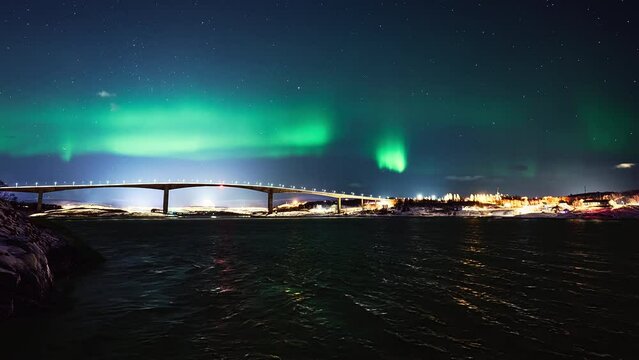 Aurora dancing above the Saltstraumen bridge, a bridge over the biggest maelstrom in the world in Bod&oslash;.