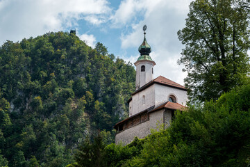 Small Kamnik castle surrounded by greenery in Slovenia.