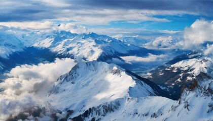 Fototapeta na wymiar snowy mountain cloudy sky in winter, seen from the sky