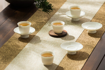 Obraz na płótnie Canvas Image of tea set, person making Asian-style tea, tea cup and teapot