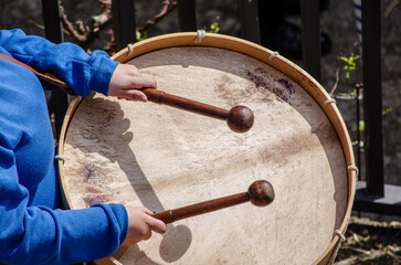 detail of a musician carrying a traditional Galician bass drum, folk music instrument