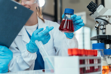 Scientist works with a pipette and a test tube. Scientific laboratory of biotechnology, development of medicine and research in chemistry, biochemistry and experiments.