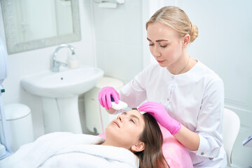 Professional procedure, skincare, woman working with customer