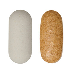 White and brown oval tablets on isolated background