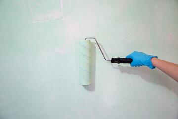 Brush the variegated color paint onto the weathered wooden plank wall