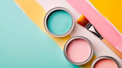 Banner with open cans of paint with brushes on them on bright symmetry background. Yellow, white, pink, blue colors of paint. Top view. - obrazy, fototapety, plakaty