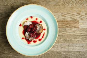 Poppy seeds bread pudding with cherry ragout and red wine