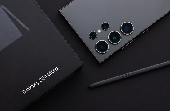 Varna, Bulgaria, 25th January 2024 - New smartphone Samsung Galaxy S24 Ultra with S - Pen on screen and details on the camera over business desk