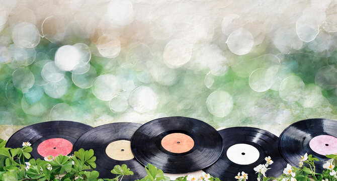 vinyl records with flovers and spring sunlight bokeh