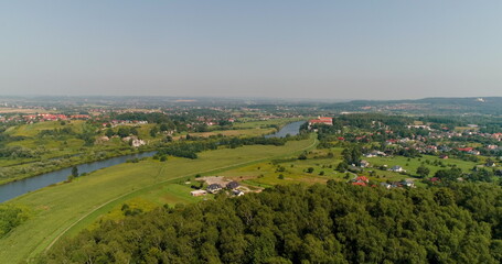 Aerial View of Landscape and Small City agains Mountains