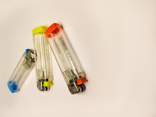 Naklejka premium three colorful matches, orange, blue and green on a white background