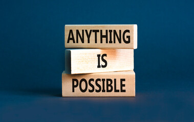 Anything is possible symbol. Concept words Anything is possible on beautiful wooden blocks. Beautiful grey table grey background. Business anything possible concept. Copy space.