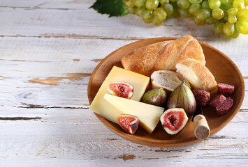 cheese plate with fresh figs and baguette
