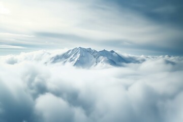 Fototapeta na wymiar splendid snowy mountain top above the clouds, dramatic sky