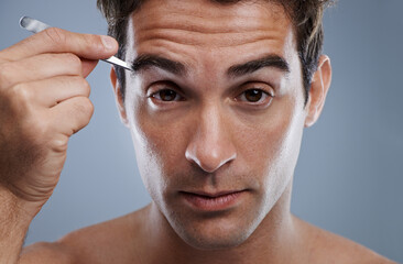 Man, portrait and tweezers for eyebrows or wellness for face grooming, hygiene or grey background....