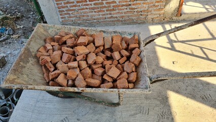 Cement cart carrying red bricks on construction sites.