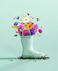  Green rubber boot full of colorful spring flowers with butterflies and bees on mint green background. Spring is here concept. 3D Rendering, 3D Illustration  © hd3dsh