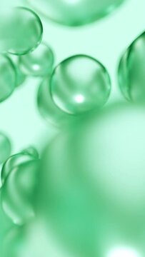 Liquid green oil bubbles macro close up. Abstract cosmetic 3D animation background of fluid circles. Beauty care concept of decorative antioxidant peptide soap spheres in light water background.
