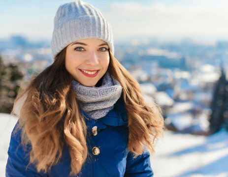 Smiling Girl in Winter Wonderland. Charming Lady on a Blurred City Background