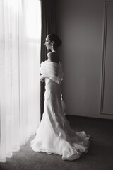 Morning and getting ready for a luxurious and beautiful bride in a hotel in a luxury room in...