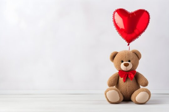  A cute teddy bear sitting with heart balloon on white background,