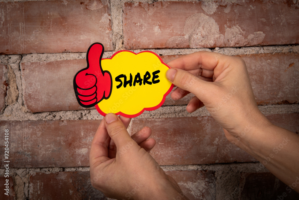 Wall mural share. sticky note with text on a red brick background