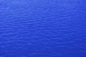 blue water surface. deep blue sea waves background. sea water waves surface texture top view.

 