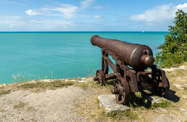 An ancient cannon pointed toward the harbor at Fort James on the island of Antigua in the Caribbean.