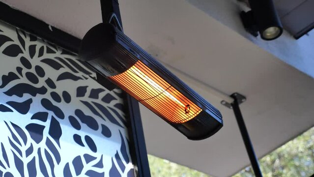 Modern electric infrared heater on celling 