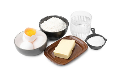 Eggs, butter, flour, salt and water isolated on white. Ingredients for puff pastry dough